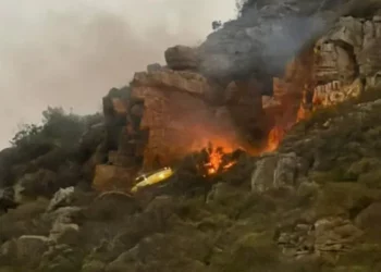 Firefighting helicopter crash scene above Hout Bay during wildfire suppression operations in Table Mountain National Park