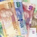 South African rand notes and a rate chart illustrating growing pressure on South Africa’s interest rate outlook.
