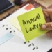 A South African office worker checking a leave calendar at a desk