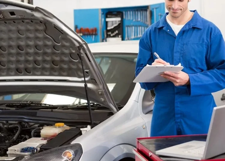 Vehicle on a hoist at a South African roadworthy testing station during inspection