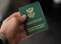 A South African green ID book and a smart ID card side by side, as the green ID book end date is confirmed