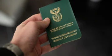 A South African green ID book and a smart ID card side by side, as the green ID book end date is confirmed
