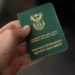 A South African green ID book and a smart ID card side by side, as the green ID book end date is confirmed