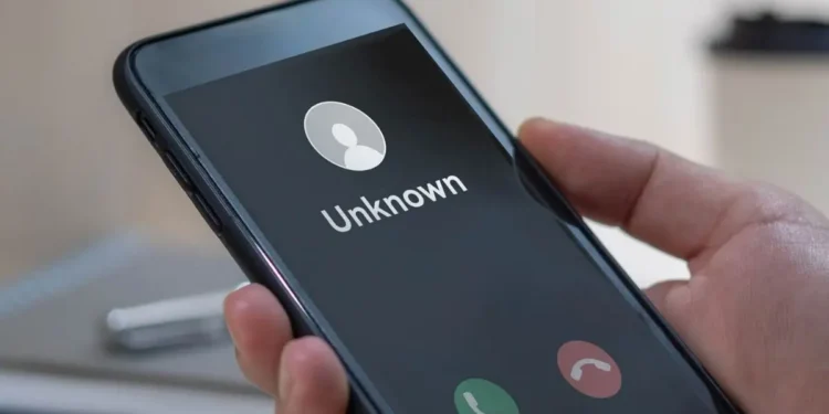 A mobile phone showing an unknown incoming call, relating to spam calls South Africa and the opt-out registry