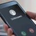 A mobile phone showing an unknown incoming call, relating to spam calls South Africa and the opt-out registry