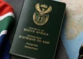 Parent and young child at a Home Affairs counter with an official